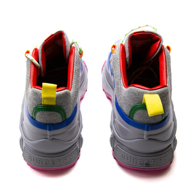 The back of the Burberry Grey Arthur Trainers displaying the multicolour gradient of grey, pink, orange, blue, and red elements.