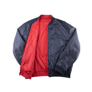 The inside of the Gucci Monogram Reversible Bomber.