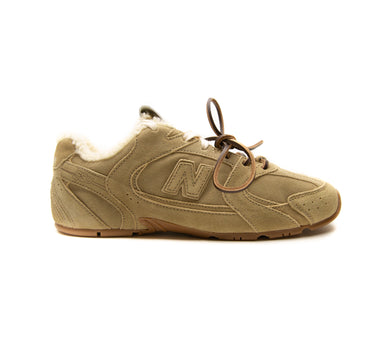 The right of the New Balance x Miu Miu 530 SL Ecru Suede Sneakers.