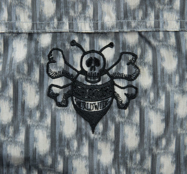 The front logo of the Dior x Shawn Stussy Oblique Jacket in White, Black, and Grey.