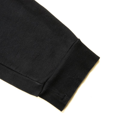 The leg of the C.P. Company Navy Lens Sweatpants.