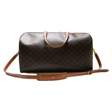 The back of the Celine Voyage bag in Triomphe Canvas with Celine print.