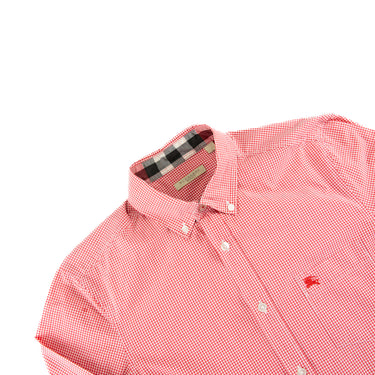 The buttons of the Burberry Check Red Button Up Shirt.