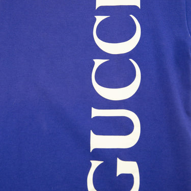 The logo of the Gucci Blue Spellout T Shirt.