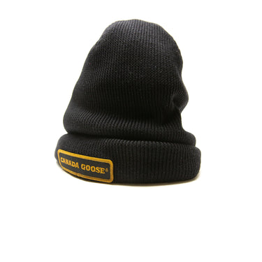 The logo of the Canada Goose Black Beanie.
