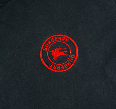 The logo of the Burberry Red Logo Black T Shirt.