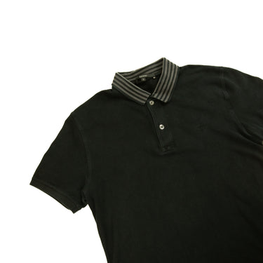 The flat lay of the Gucci Black Embroidered Logo Polo Shirt.