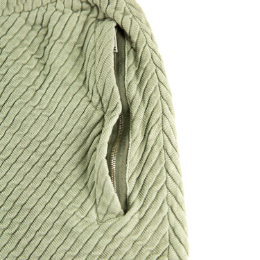 The pocket of the Represent Ottoman Green Shorts.