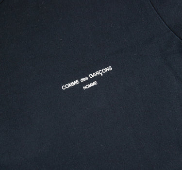The logo of the Comme Des Garçons Homme Black T Shirt.