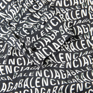 The logo of the Balenciaga All Over Wave Logo Shirt.