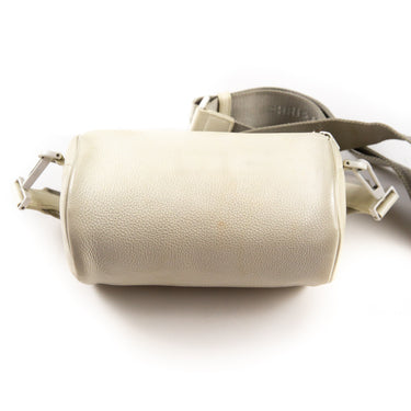 The back of the Dior x Daniel Arsham White Leather Roller Bag, showcasing its elegant design.