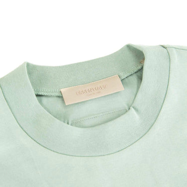 The inside label of the Fear Of God ESSENTIALS Sycamore T Shirt XS.