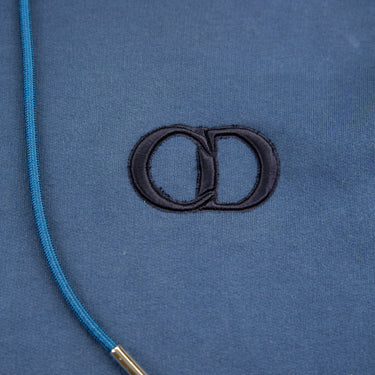 The logo of the Dior CD Icon Blue Hoodie.