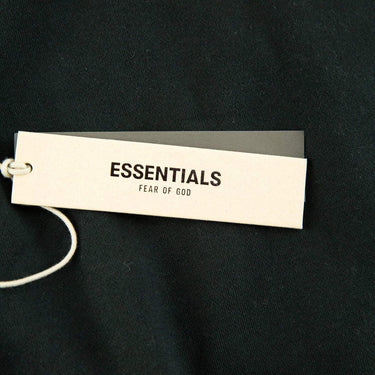 The tags of the Fear Of God ESSENTIALS Stretch Limo Hoodie S.