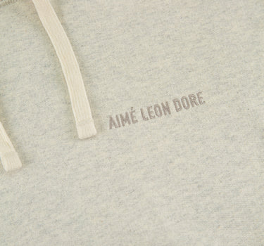 The logo of the Aimé Leon Dore Tonal Logo Oatmeal Hoodie.