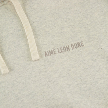 The logo of the Aimé Leon Dore Tonal Logo Oatmeal Hoodie.