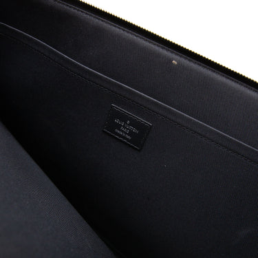 The inside label of the Louis Vuitton Damier Graphite Pochette Bag.
