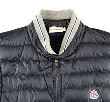 The front logo of the Moncler Navy Magllia Gilet.