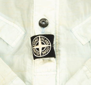 The logo of the Stone Island Reflective Grid On Lamy-TC Jacket.