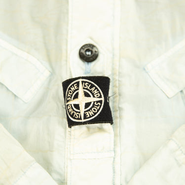 The logo of the Stone Island Reflective Grid On Lamy-TC Jacket.
