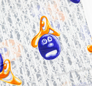 The logo of the Dior x Kenny Scharf Oblique Mesh T Shirt.