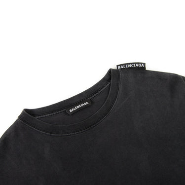 The inside label of the Balenciaga Black Shoulder Tag T-shirt, showing brand details.