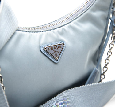 Shows the logo of the Prada Light Blue Re-Nylon Shoulder Bag.