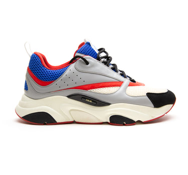 The right of the Dior Dior B22 Grey Red Blue Trainer.