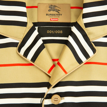 The inside label of the Burberry x Supreme Icon Silk Pajama Shirt Archive Beige.