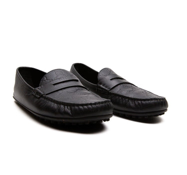 The front of Gucci Black Loafers for men.