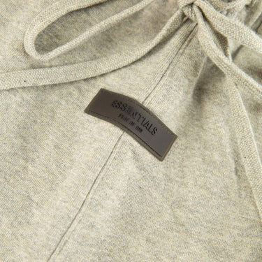 The logo of the Fear Of God ESSENTIALS Dark Oatmeal Shorts M.