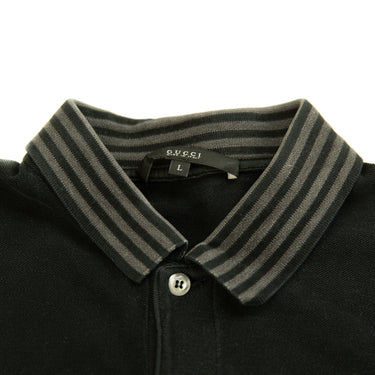 The collar of the Gucci Black Embroidered Logo Polo Shirt.
