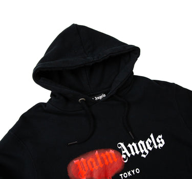 The hood of the Palm Angels Spray Logo Black Hoodie.