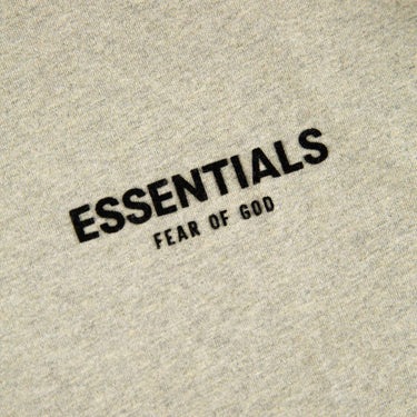 The logo of the Fear Of God ESSENTIALS Dark Oatmeal T Shirt.