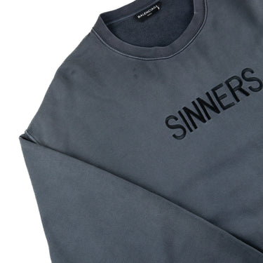 The logo of the Balenciaga Sinners Sweatshirt.