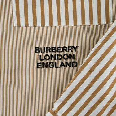 The logo of the Burberry Orange Striped Shirt.