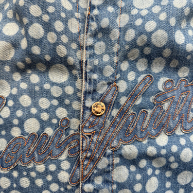 The logo of the Louis Vuitton X Yayoi Kusama Blue Dot Baseball Shirt.