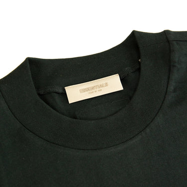 The inside label of the Fear Of God ESSENTIALS Stretch Limo T Shirt.