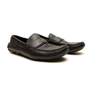 The front of the Prada Black Leather Slip On Loafers.