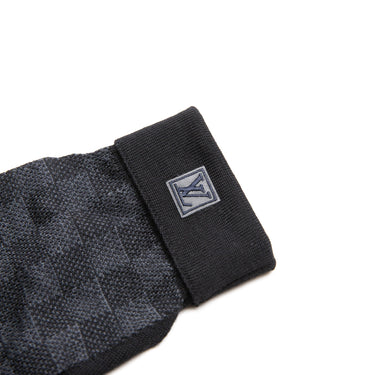 The logo of the Louis Vuitton Damier Graphite Wool Gloves.