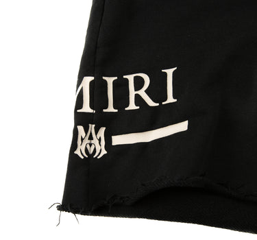 The logo of the Amiri Black Shorts.