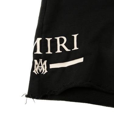 The logo of the Amiri Black Shorts.