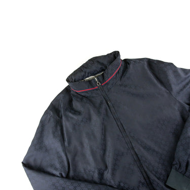 The flat lay of the Gucci Navy Monogram Jacket.