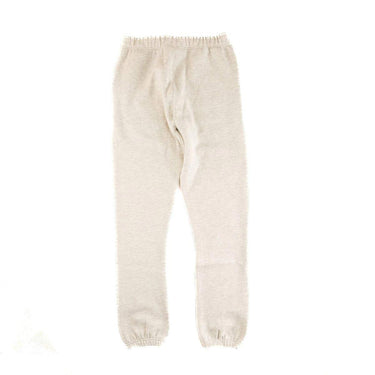 The back of the Fear Of God ESSENTIALS Light Oatmeal Sweatpants L.