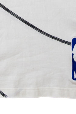 The markings of the Louis Vuitton x NBA Embroidered T Shirt.