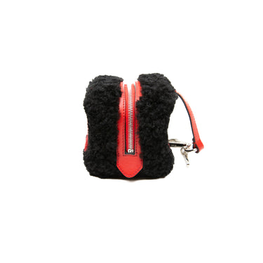 Duplicate of the left view of a Fendi Dice Box Bag in Black & Red.