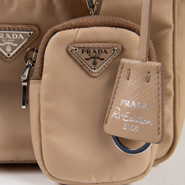 The logo of the Prada Beige Nylon Shoulder Bag.