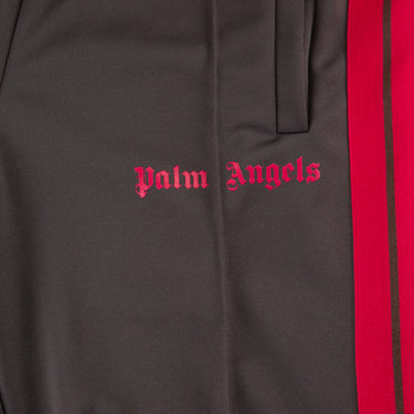 The logo of the Palm Angels Grey & Pink Sweatpants.