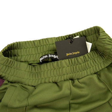 The inside label of the Palm Angels Military Green and Purple Sweatpants.