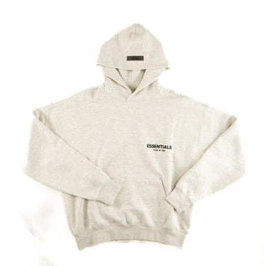 The front of the Fear Of God ESSENTIALS Light Oatmeal Hoodie L.
